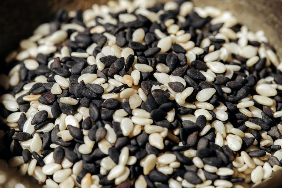 Black and white sesame seeds in a bowl